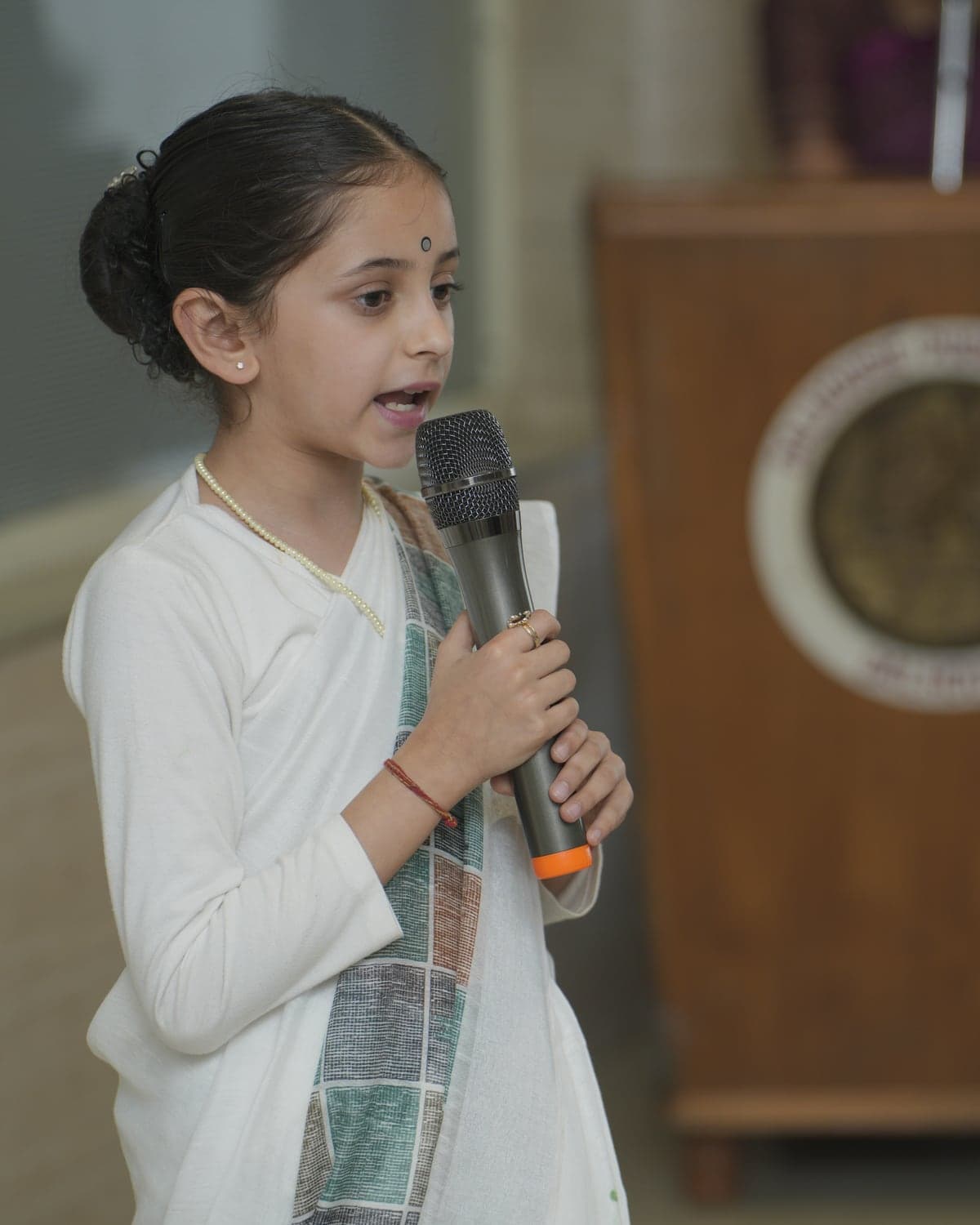 A Dalhousie student speaking into a microphone at assembly