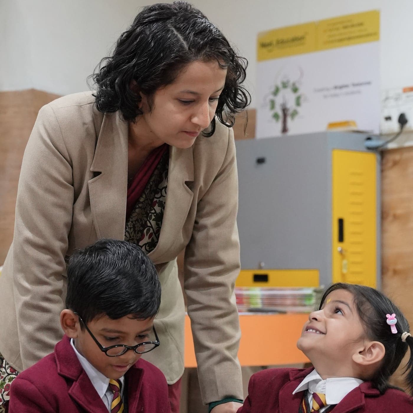 A Dalhousie teacher with two children at their desk